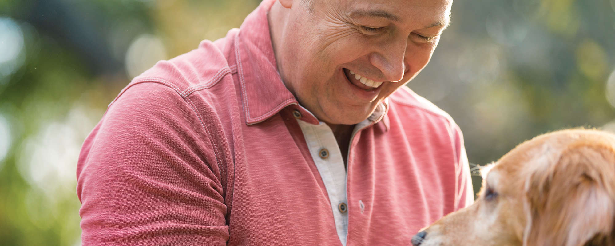 Background Image 1.1.2 A Older man petting Beagle